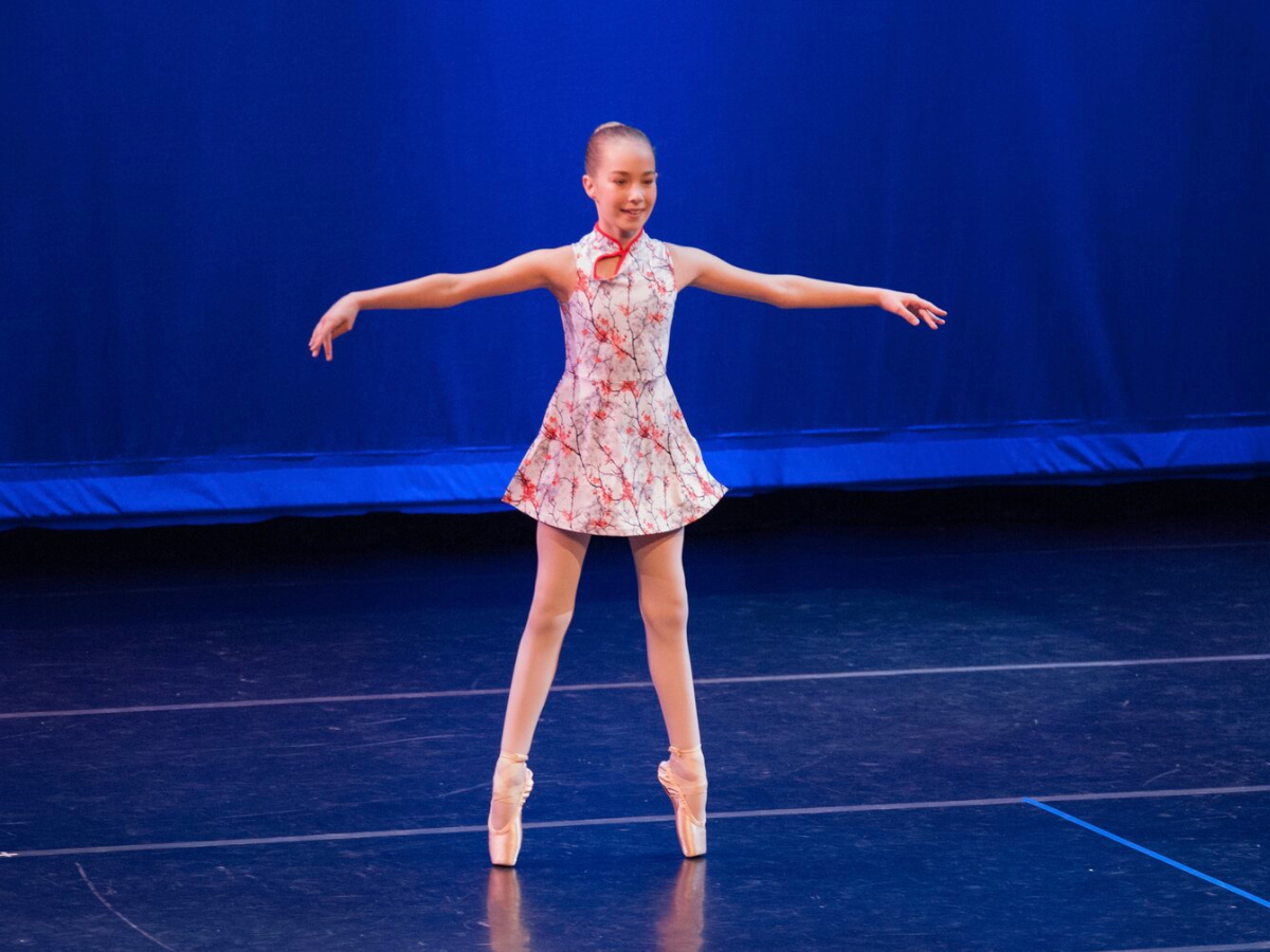 Woman dancing wearing ballet shoes, performance